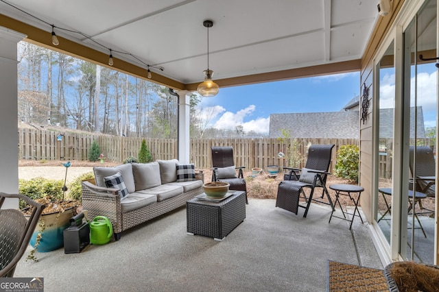 view of patio with an outdoor living space and a fenced backyard