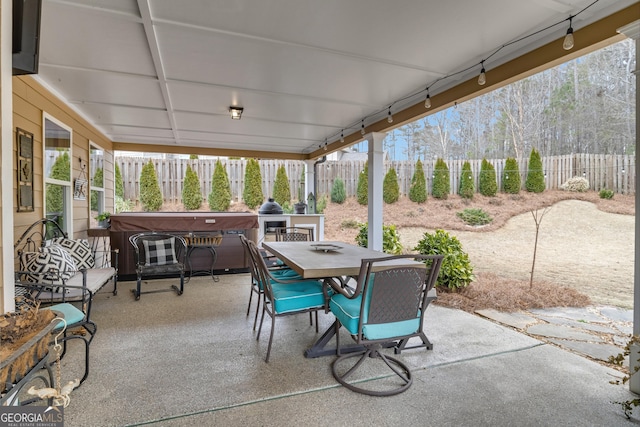 view of patio featuring outdoor dining space and a fenced backyard