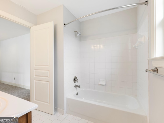 full bath featuring baseboards, vanity,  shower combination, and tile patterned flooring