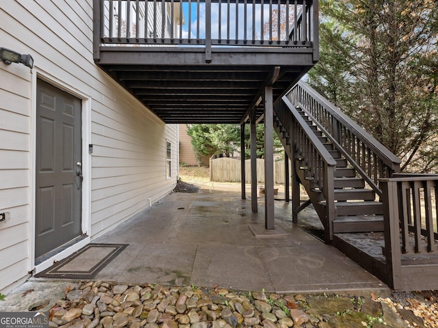 view of patio with a carport and stairway