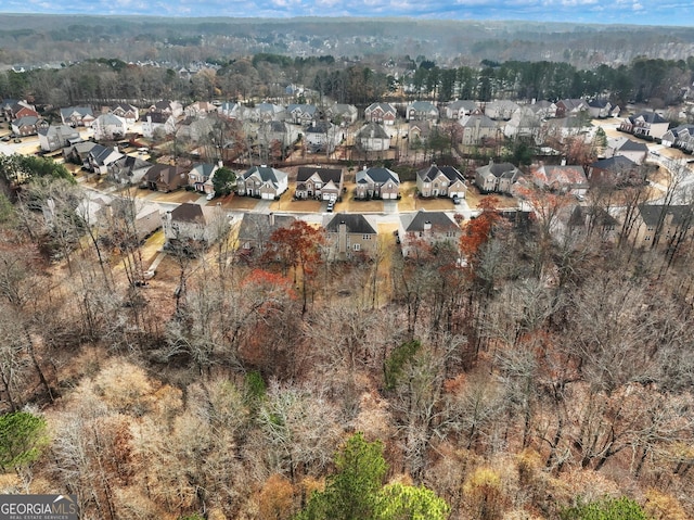 aerial view with a wooded view and a residential view