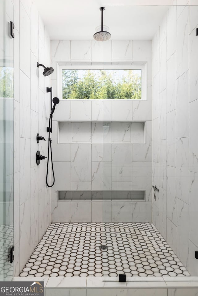 full bathroom featuring a shower stall