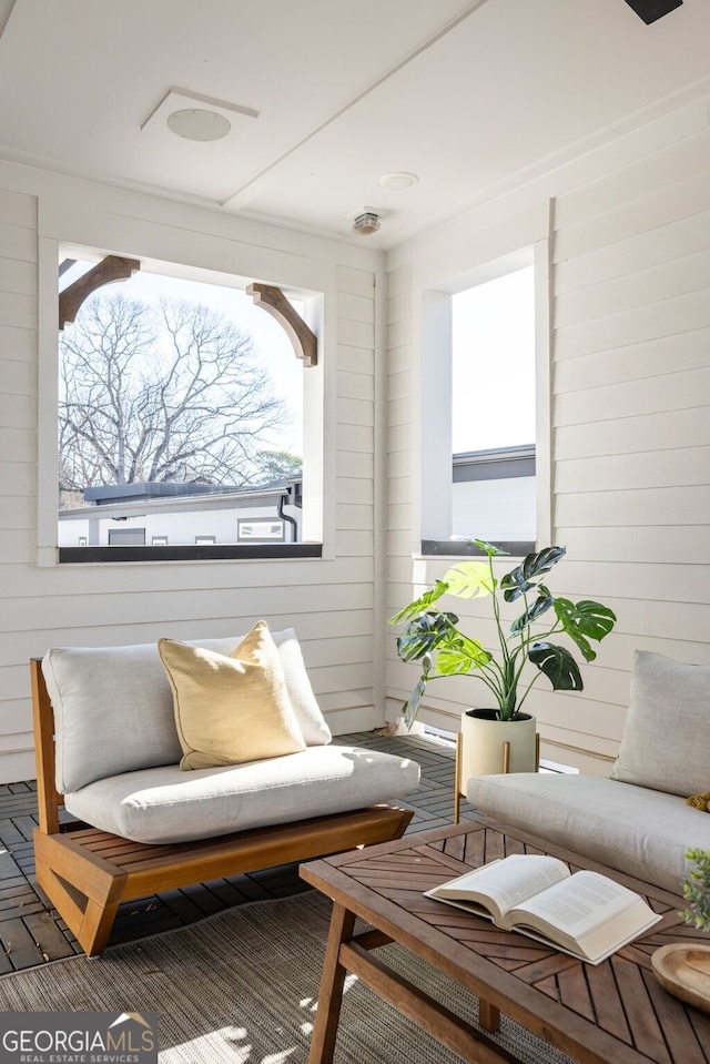 living room with wood walls