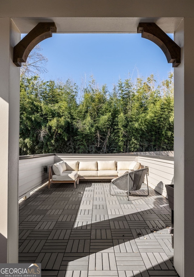 wooden deck with an outdoor hangout area