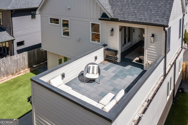 wooden deck featuring a lawn and fence