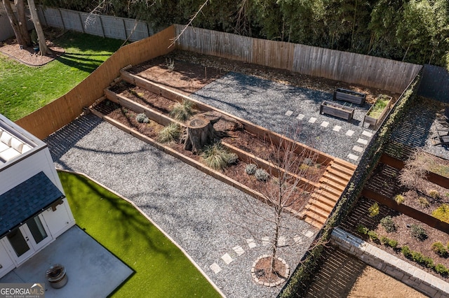 exterior space featuring a fenced backyard and a vegetable garden