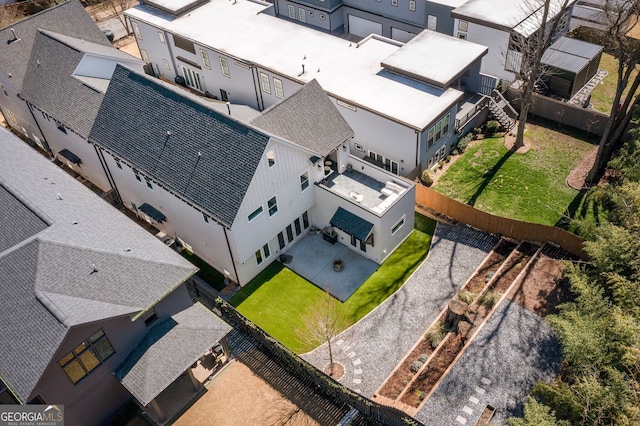 birds eye view of property with a residential view