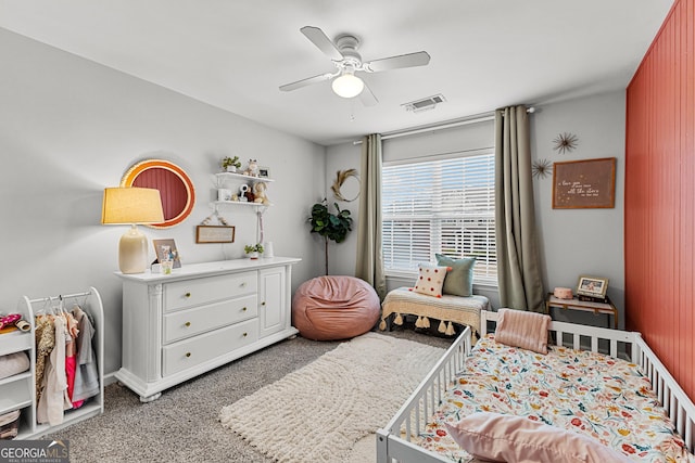 bedroom featuring visible vents, light carpet, baseboards, and a ceiling fan