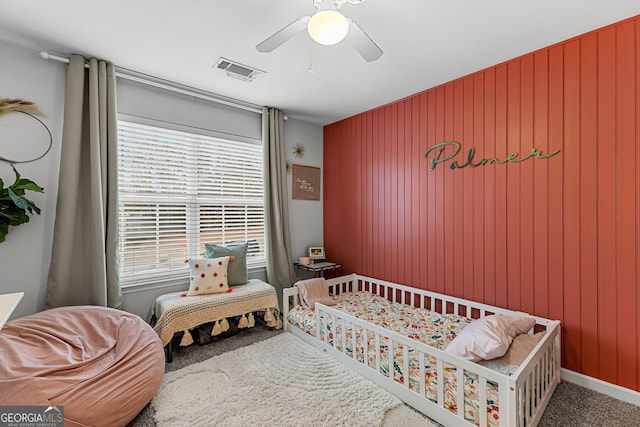 bedroom with visible vents, ceiling fan, and carpet