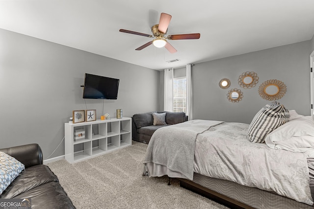 bedroom with visible vents, a ceiling fan, baseboards, and carpet floors