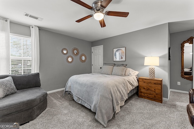 bedroom with visible vents, ceiling fan, baseboards, and carpet floors