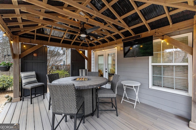 deck featuring french doors and outdoor dining area