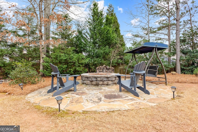 view of patio / terrace with an outdoor fire pit