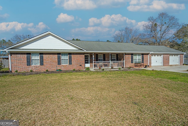 ranch-style home featuring a front yard, a garage, covered porch, and brick siding