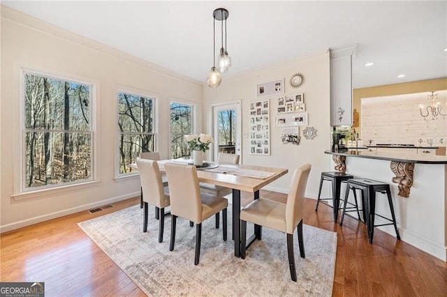 217 Colonial Dr, Woodstock, GA 30189 - dining room featuring baseboards, wood finished floors, a chandelier, and recessed lighting