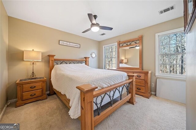 217 Colonial Dr, Woodstock, GA 30189 - bedroom featuring light carpet, a ceiling fan, and baseboards