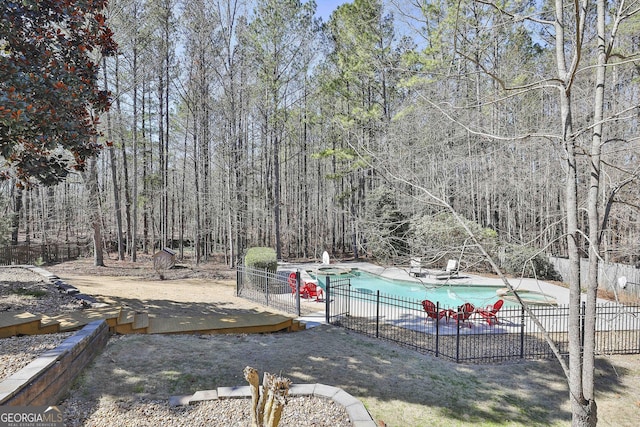 view of pool with a fenced in pool, a patio, and fence