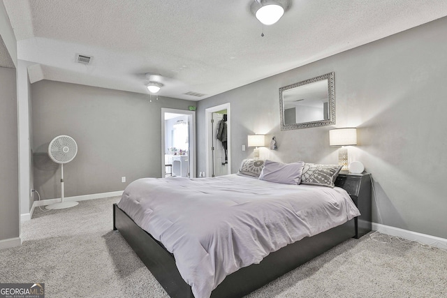 bedroom featuring visible vents, baseboards, a textured ceiling, and carpet flooring