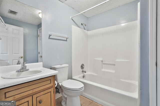 full bathroom featuring visible vents, a textured ceiling, vanity, and toilet