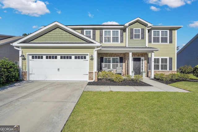 view of front of home with a front lawn, an attached garage, brick siding, and driveway