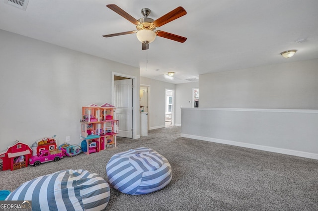 rec room featuring visible vents, carpet flooring, a ceiling fan, and baseboards