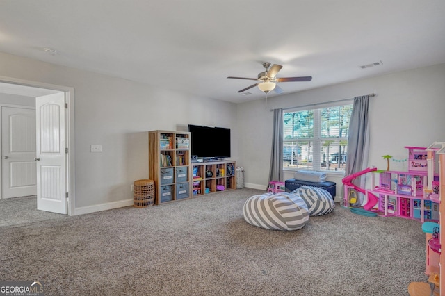 game room with visible vents, ceiling fan, baseboards, and carpet