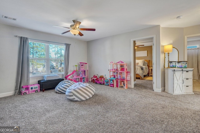 rec room featuring visible vents, baseboards, and carpet floors