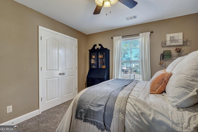 carpeted bedroom with visible vents, ceiling fan, and baseboards