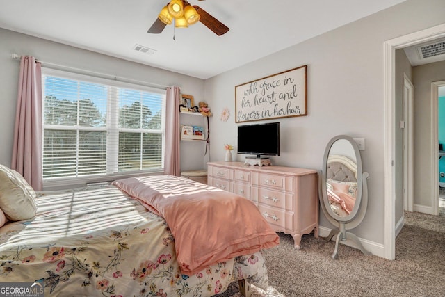 carpeted bedroom with baseboards, visible vents, and ceiling fan