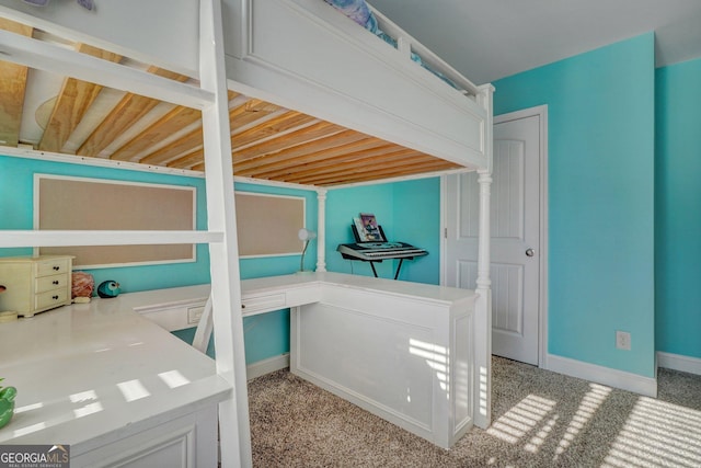 carpeted bedroom with baseboards