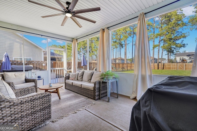 sunroom / solarium with ceiling fan