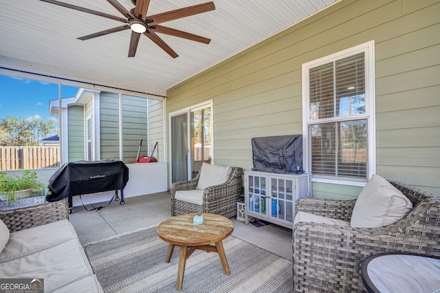 sunroom with a wealth of natural light and ceiling fan