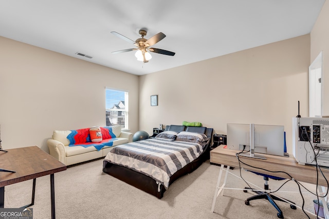 carpeted bedroom with ceiling fan and visible vents