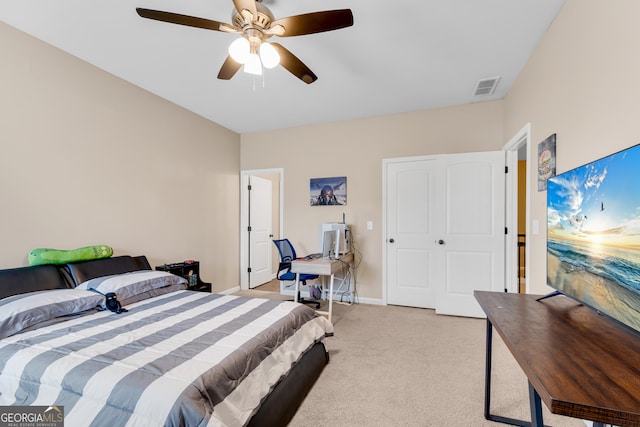 bedroom with a ceiling fan, baseboards, visible vents, and light carpet