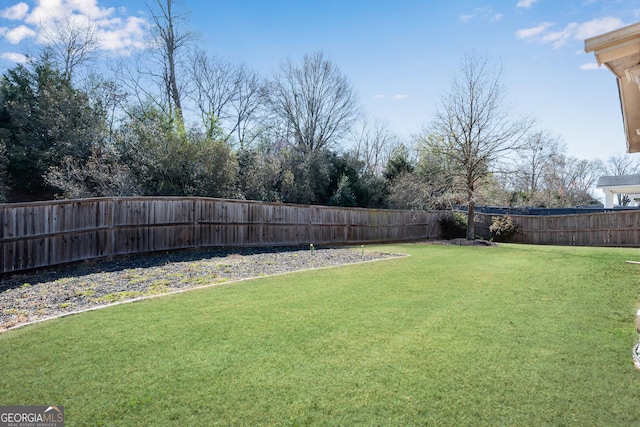 view of yard featuring a fenced backyard
