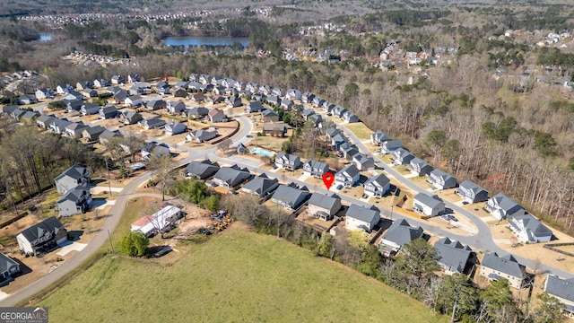 aerial view featuring a water view and a residential view