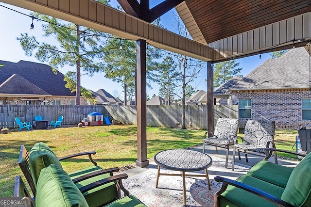 view of patio featuring an outdoor living space and a fenced backyard