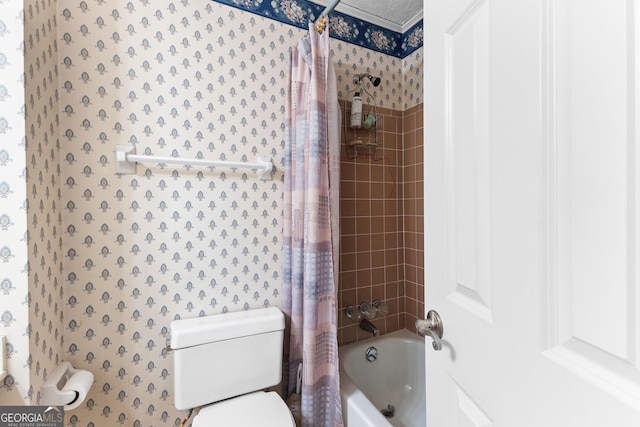 bathroom with toilet, shower / tub combo, and wallpapered walls