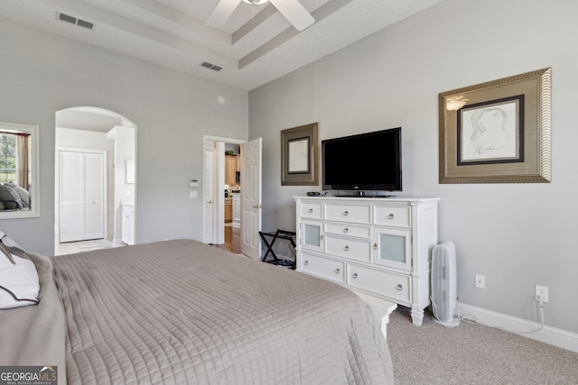 246 Heron Ct, Saint Marys, GA 31558 - bedroom with visible vents, arched walkways, light colored carpet, and baseboards
