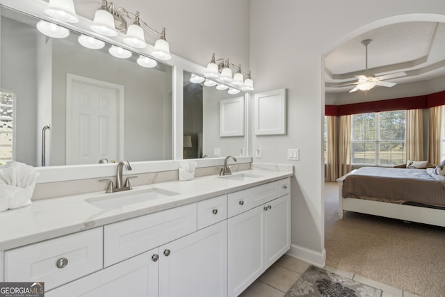 246 Heron Ct, Saint Marys, GA 31558 - ensuite bathroom featuring a sink, ensuite bath, a ceiling fan, and tile patterned flooring