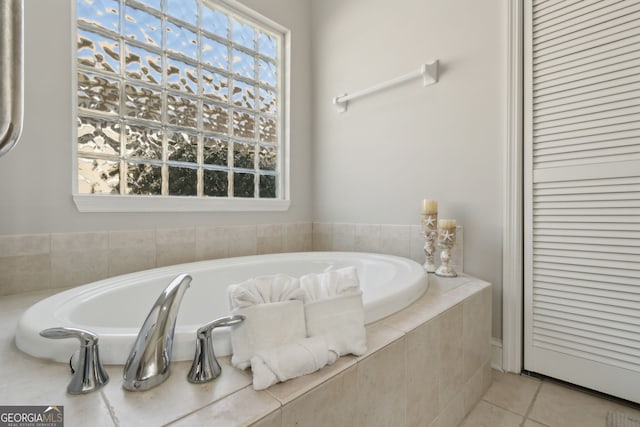 246 Heron Ct, Saint Marys, GA 31558 - bathroom featuring a garden tub and tile patterned flooring