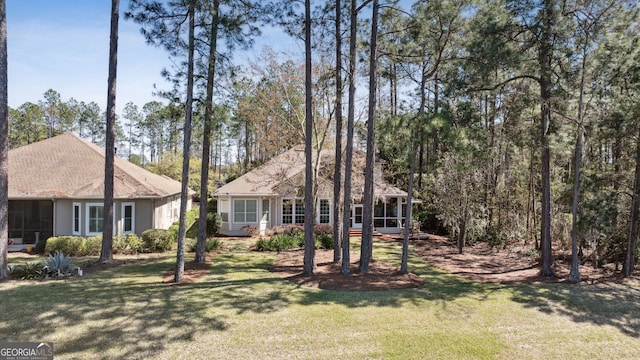 246 Heron Ct, Saint Marys, GA 31558 - view of front of home featuring a front yard and a sunroom