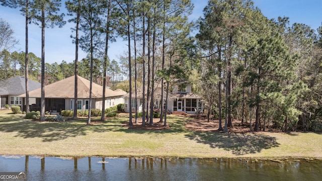 246 Heron Ct, Saint Marys, GA 31558 - back of house with a water view, a yard, and a sunroom