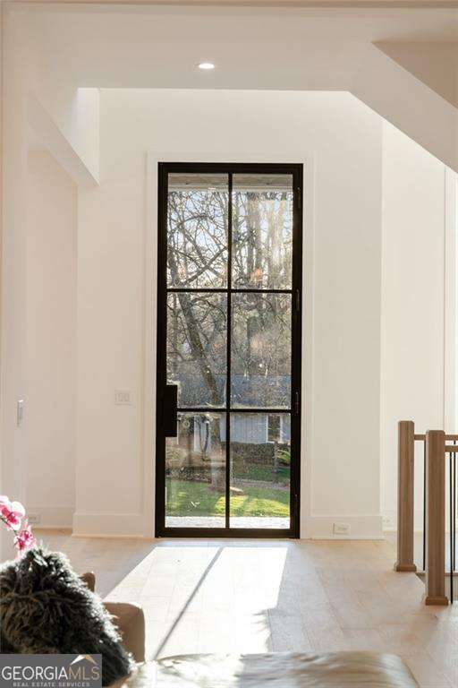 entryway featuring recessed lighting and baseboards