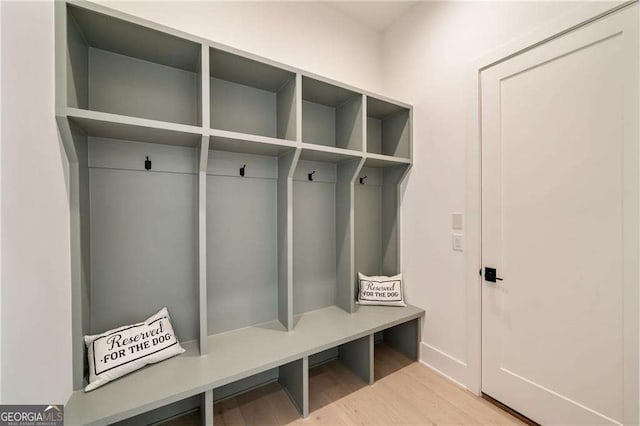 mudroom with wood finished floors