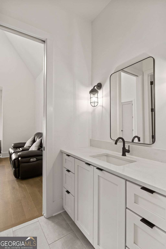 bathroom featuring vanity and wood finished floors