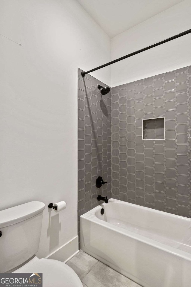 full bath with tile patterned floors, baseboards, toilet, and bathtub / shower combination