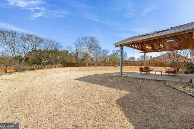 view of yard with a patio area and a fenced backyard