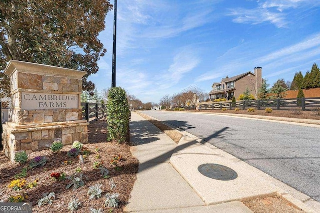 view of road with curbs and sidewalks