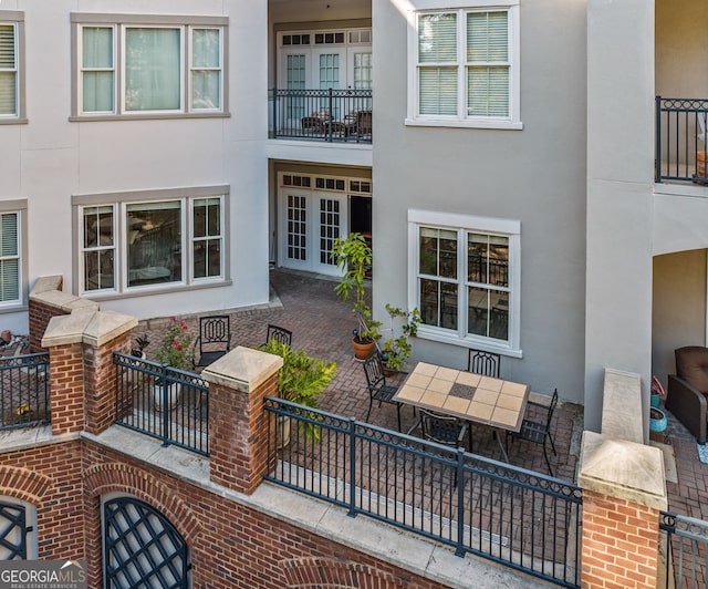 view of patio / terrace featuring outdoor dining space and french doors